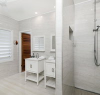 Bathers across the bay from Port Douglas - Accommodation Mooloolaba